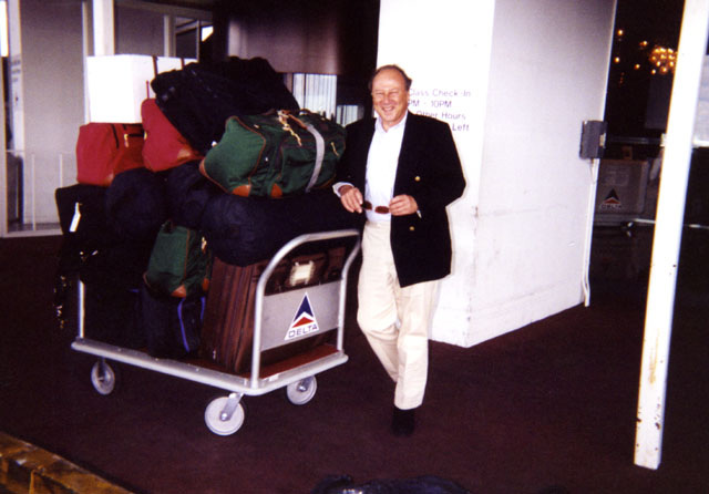 Paul in airport with luggage